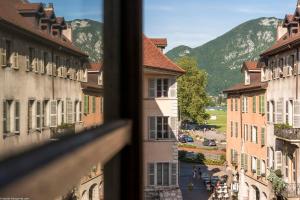 a view from a window of a city with buildings at Annecy Historical Center - 160 square meter - 3 bedrooms & 3 bathrooms in Annecy