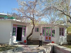 a man standing in front of a house at The Indian Kargil in Kargil