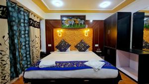 a bedroom with a large bed in a room at The Indian Kargil in Kargil