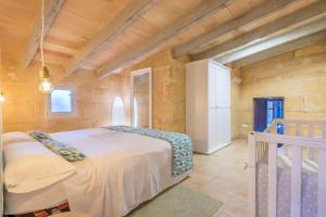 a bedroom with a bed in a room with wooden walls at Sant llorens - 4341-21 Mallorca in Sant Llorenç des Cardassar +61 photos