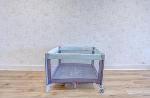 a blue shopping cart in front of a wall at Beverly Hills Studio Apartment 2 Queen Beds in Galveston