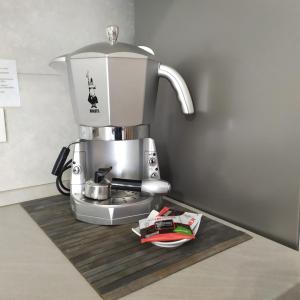 a coffee maker sitting on top of a counter at Appartamento Signorini Bolognaholidayhome - Parcheggio e Giardino privato - Holiday House Bologna Garden Parking in Bologna