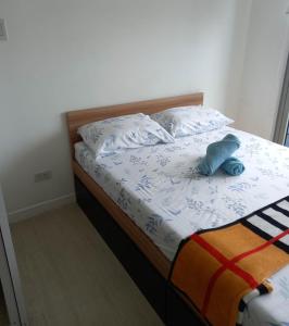 Postel nebo postele na pokoji v ubytování SM Bicutan Rooms