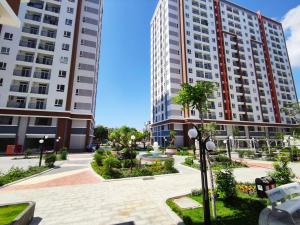 a view of two tall buildings in a city at An's House In Phan Rang in Kinh Dinh