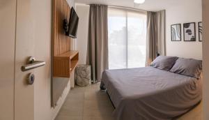 Postel nebo postele na pokoji v ubytování Departamentos General Paz by Lugar + 50 fotografií