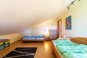 a bedroom with two beds in a attic at Ferienhaus Landleben und Meer in Tetenbüll