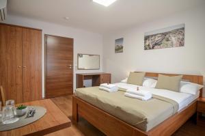 Postel nebo postele na pokoji v ubytování Residence Malva