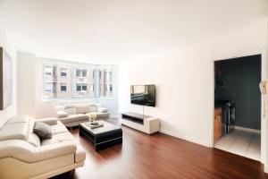 a living room with a couch and a tv at Apartment with a beautiful view in New York
