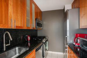 a kitchen with a sink and a stove at Apartment with a beautiful view in New York