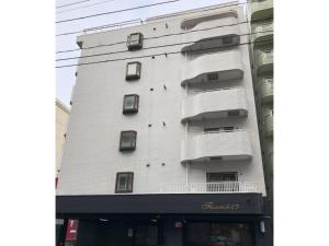 a white building with balconies on the side of it at Florish 67 - Vacation STAY 15424v in Sapporo