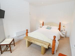 Ένα ή περισσότερα κρεβάτια σε δωμάτιο στο Pat's Cottage