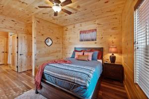 a bedroom with a bed in a log cabin at Entire cabin in Sevierville, Tennessee in Sevierville