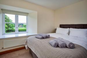 Finest Retreats - Victory Mill - Apartment Two tesisinde bir odada yatak veya yataklar