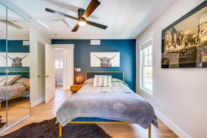 a bedroom with a bed and a ceiling fan at Westminster Vacation Rental about 15 Mi From Denver in Westminster