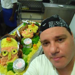 a man standing in front of a tray of sushi at Hotel Rosy in Bellaria-Igea Marina