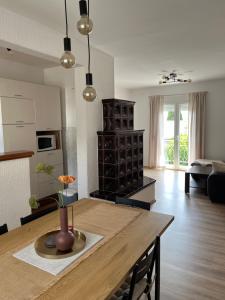 a kitchen and living room with a wooden table at Villa Marija in Crikvenica