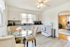 a kitchen with a glass table and chairs at Wilmington Vacation Rental Near River and Downtown! in Wilmington