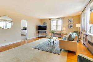 a living room with a couch and a table at Wilmington Vacation Rental Near River and Downtown! in Wilmington