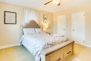 a bedroom with a large bed and a ceiling fan at Wilmington Vacation Rental Near River and Downtown! in Wilmington