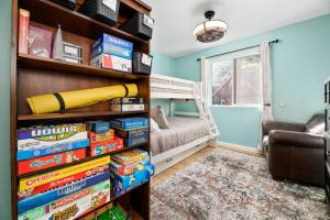 a room with a book shelf filled with books at Casa de Campo - Beautiful mountain home equipped with everything you need for a relaxing getaway! in Big Bear City
