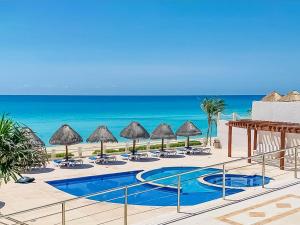 a view of the beach from the resort at Villa Aurora Beautiful Beachfront Apartment in Cancún