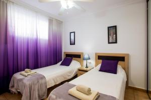 Ένα ή περισσότερα κρεβάτια σε δωμάτιο στο Playa la Arena apartment