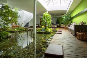a living room with a koi pond at Naudererhof - 4-Stern-Superior in Nauders +132 photos