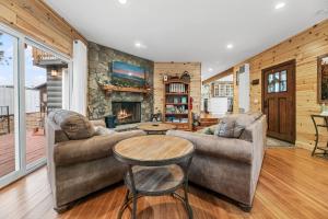 a living room with two couches and a fireplace at Casa Luna- Beautiful Maltby style home, just a short drive from Big Bear's attractions! in Big Bear City