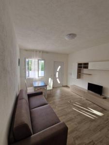 a living room with a couch and a table at Casa Rosa Forio d'Ischia in Forio d'Ischia