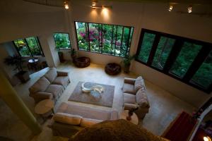 an aerial view of a living room with couches and windows at Monkey Flower Villas in Ko Tao