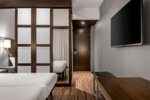 Postel nebo postele na pokoji v ubytování AC Hotel by Marriott Pisa