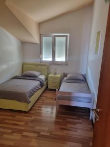 Postel nebo postele na pokoji v ubytování Apartment Lena