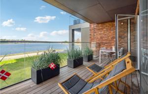 a balcony with a view of the water at Beach Front Apartment In Snderborg With Wifi in Sønderborg