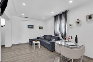 a living room with a couch and a glass table at Sunny Garden Apartments Ana in Makarska