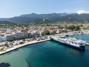 a cruise ship docked in a harbor with a city at Marina View in Limenas