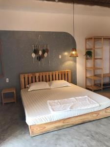 a bedroom with a large bed in a room at Blue Sea Homestay 2 in Phu Yen