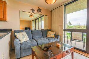 a living room with a couch and a table at Kuhio Shores 107 in Kukuiula