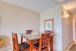 a dining room with a table and chairs at Kuhio Shores 107 in Kukuiula