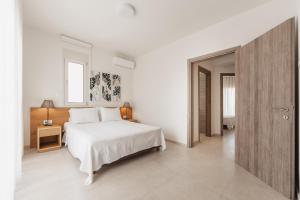 Postel nebo postele na pokoji v ubytování Kalisun Exclusive Villas + 21 fotografií