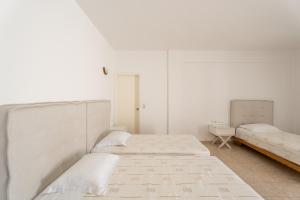 Llit o llits en una habitació de Lofos Village