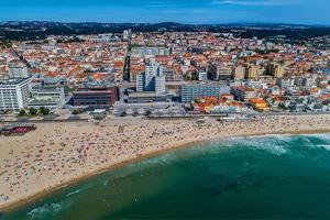 an aerial view of a beach with a crowd of people at Casa de Férias_As Oliveiras I in Espinho