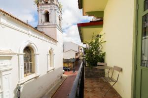 a view of a street with a clock tower at AmazINN Places Deluxe Estudio Casa Marichu Casco Viejo in Panama City