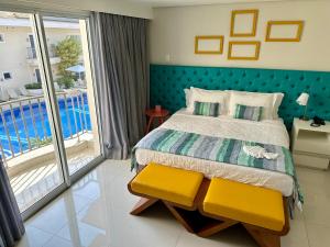 Cama ou camas em um quarto em Doral Guarujá