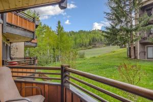 a balcony with a view of a yard at Laurelwood Condominiums 408 in Snowmass Village