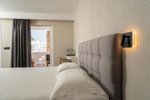 Llit o llits en una habitació de Lofos Village