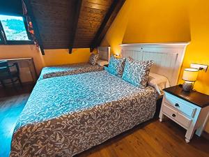 Cama o camas de una habitación en Hotel Rural Pajarapinta