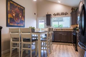 a kitchen with a dining room table and chairs at Cozy Quiet two story home pool outdoor entertaining bbq in Chandler