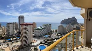 a balcony with a view of the ocean and buildings at Apto One More Day in Ambar in Calpe