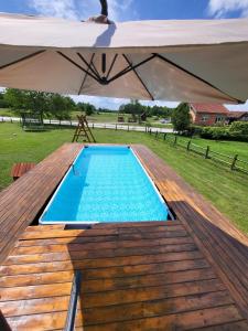 an overhead view of a swimming pool under an umbrella at Kuća za odmor Jopi i Mare in Topusko