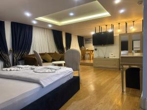 a hotel room with a bed and a living room at Hotel Next2 in Istanbul